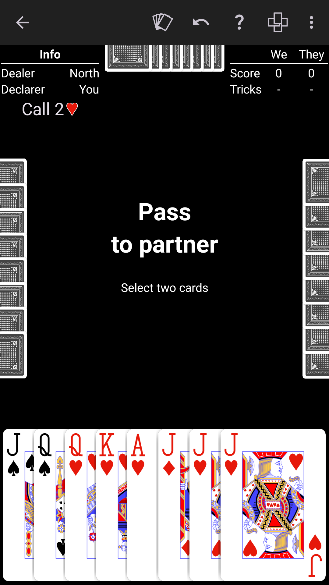 Bid Euchre played on a high-contrast black table