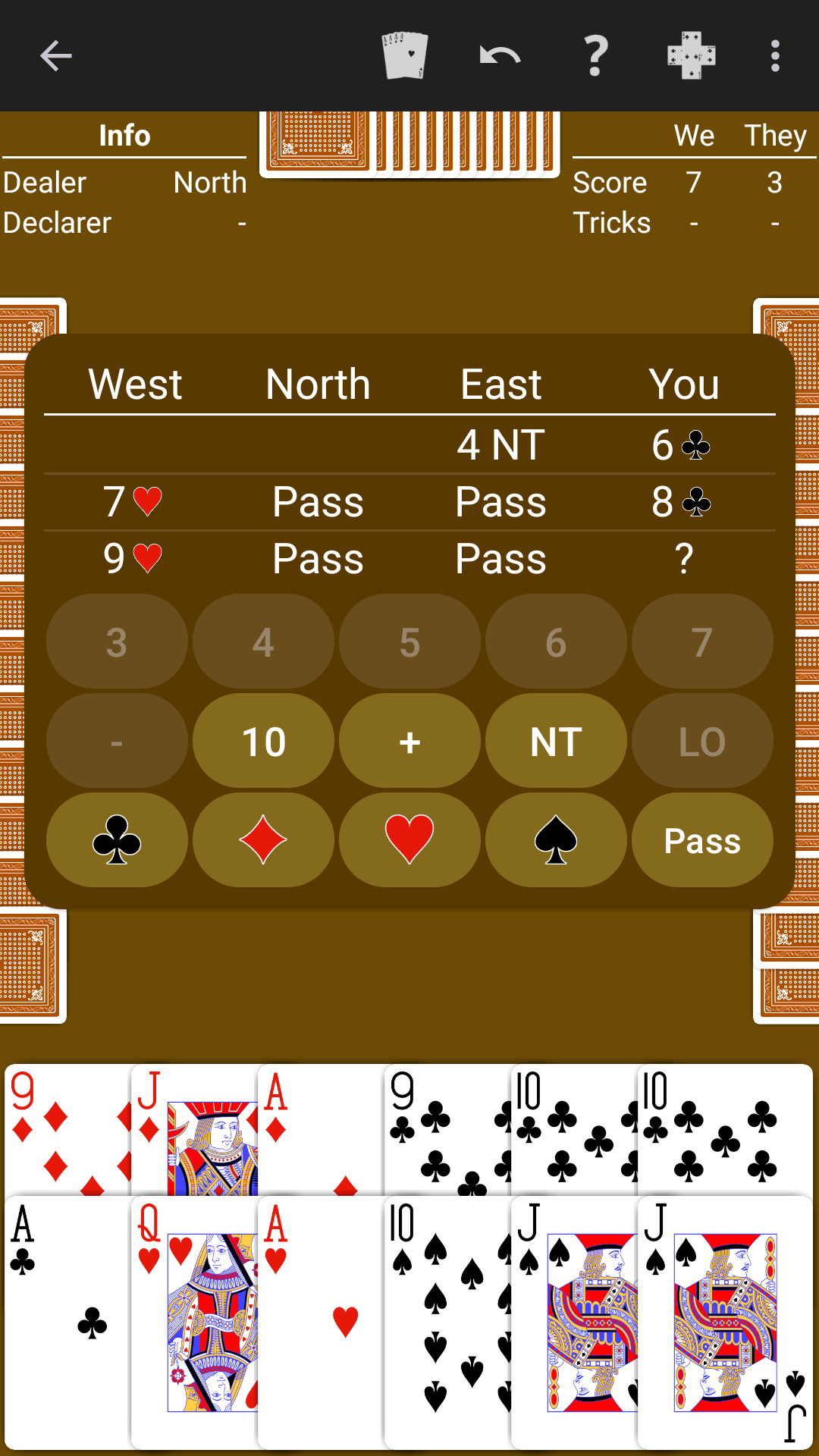 Bid Euchre played on a warm brown table