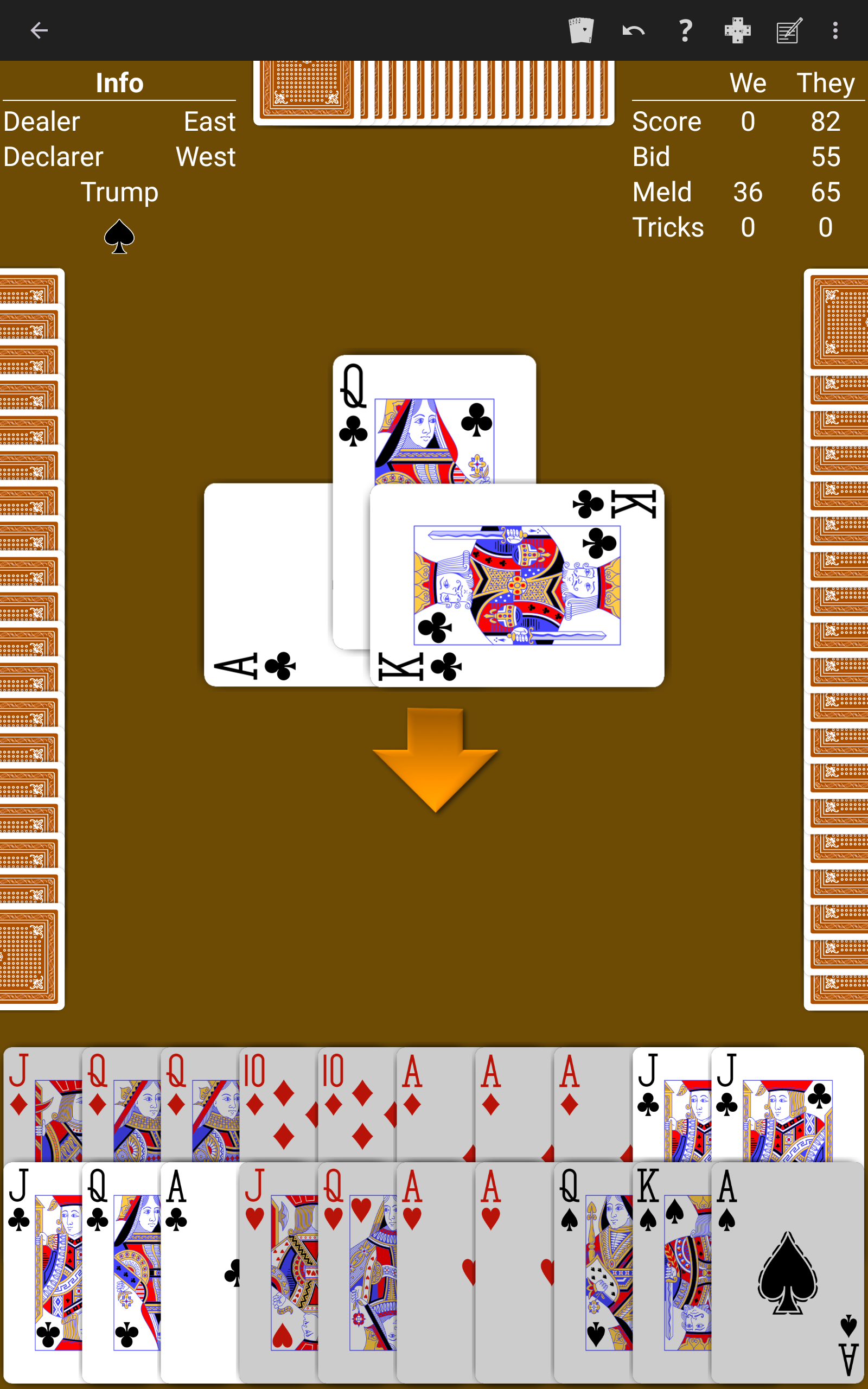 Pinochle played on a warm brown table