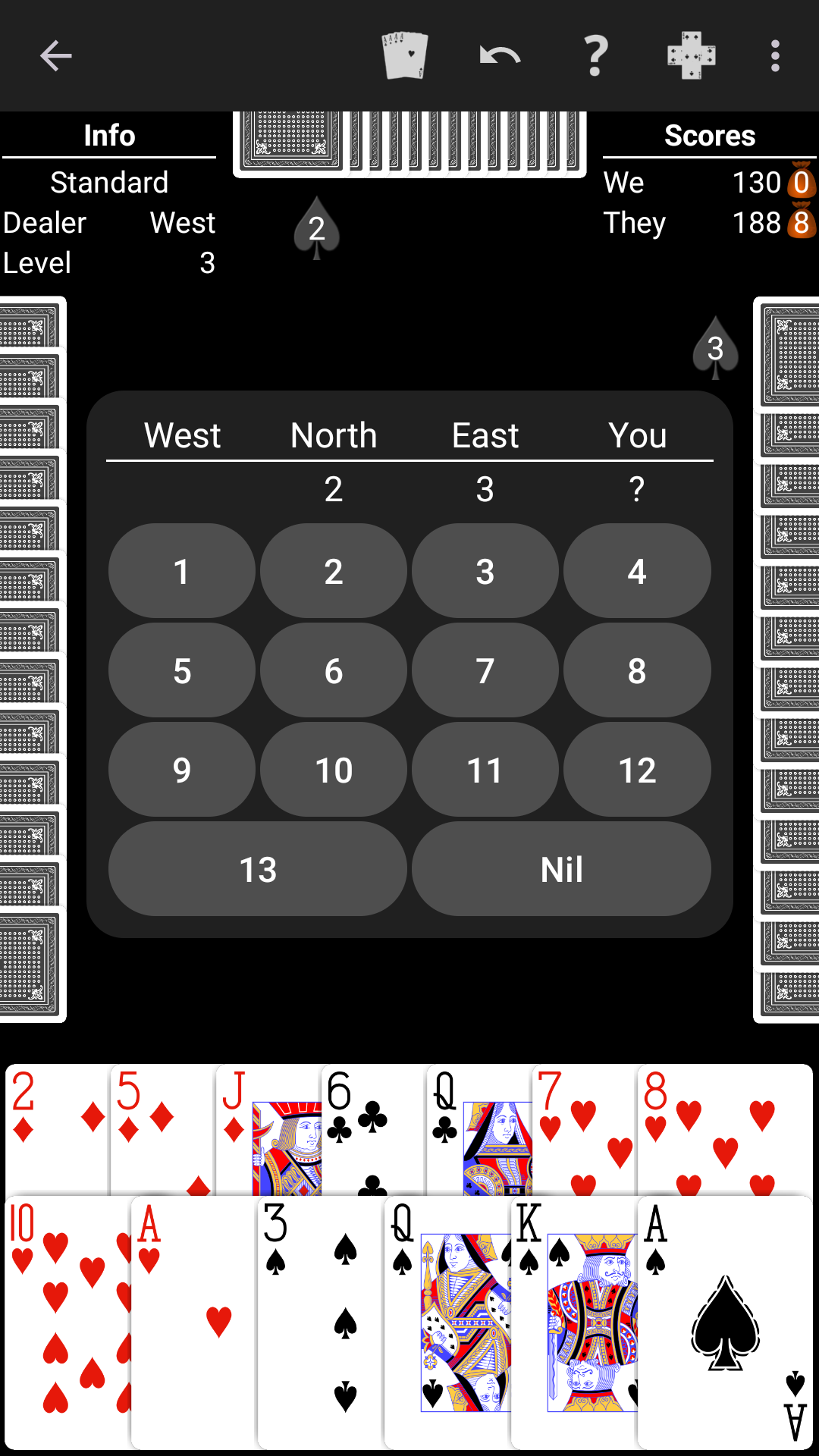 Spades played on a high-contrast black table
