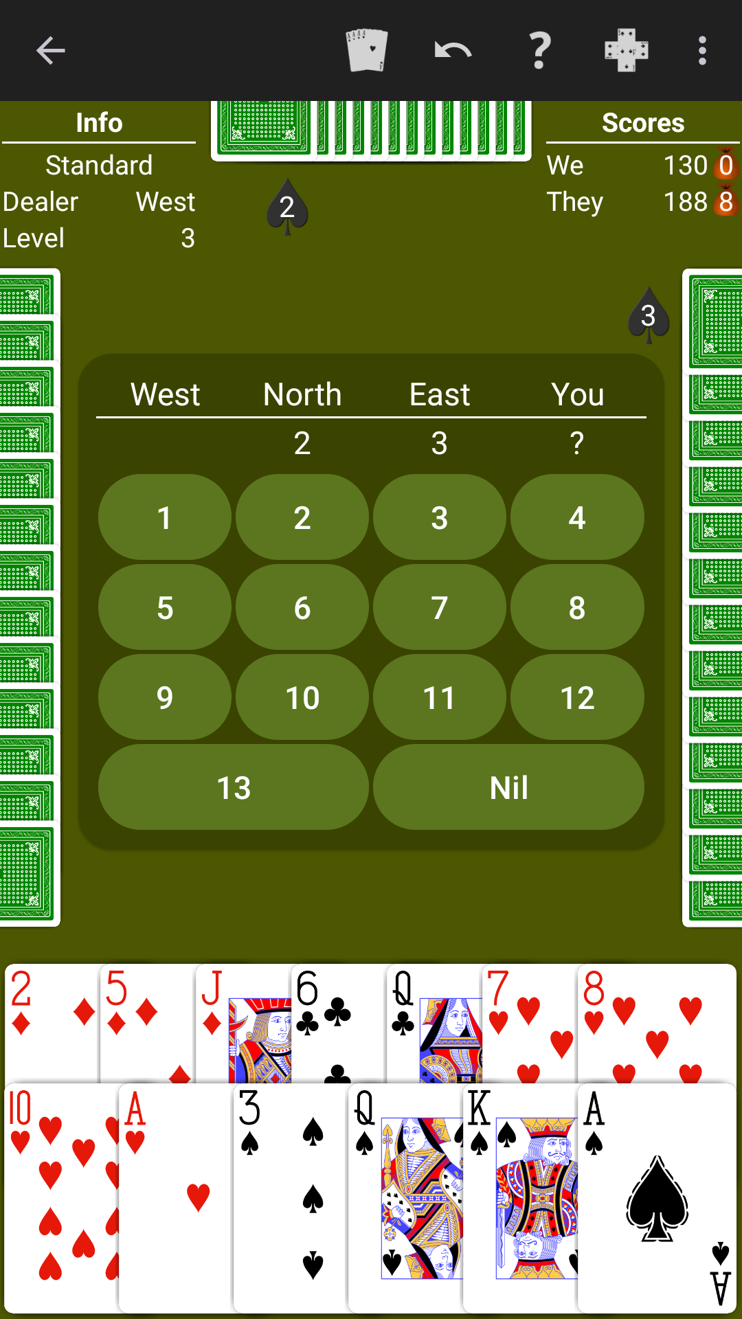Spades played on a bright green table